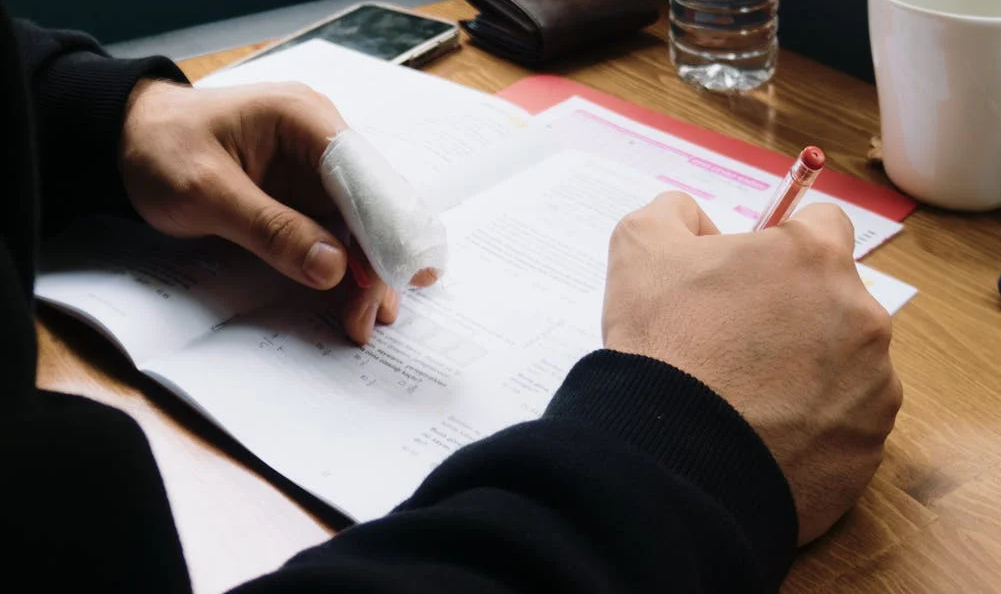 Lawyer reviewing a workers compensation claim with an injured employee.